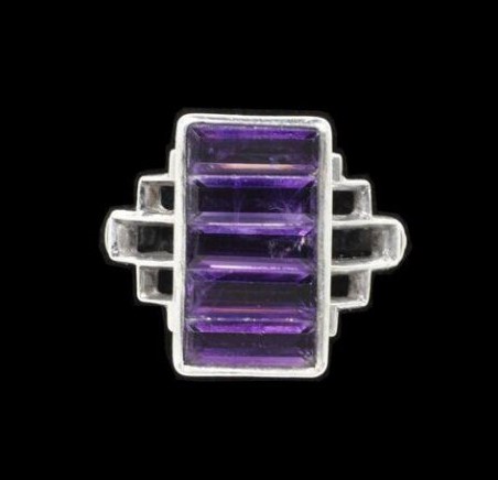 Arts and Crafts ring with four rectangular-cut amethysts in silver setting.