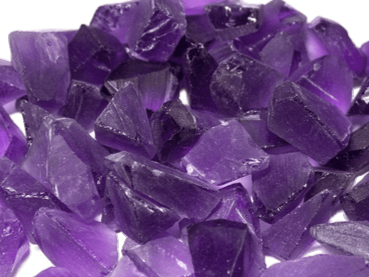 Deep purple Bolivian amethyst crystals with angular shapes and high saturation.